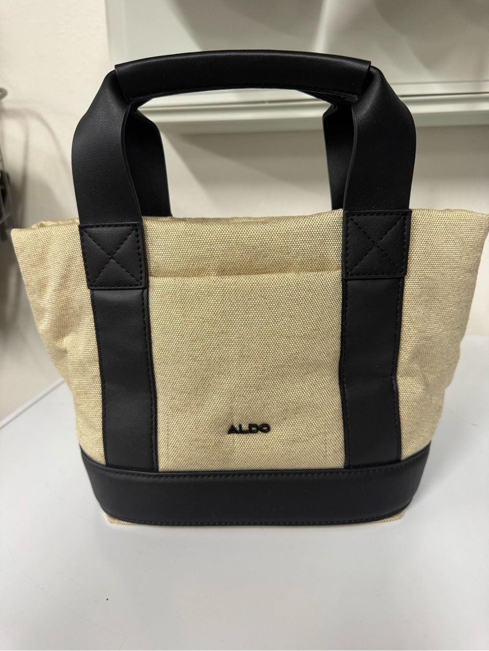 Aldo Beige Canvas Tote with Black Trim and Handles